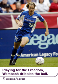 Playing for thte Freedom, Wambach dribbles the ball.